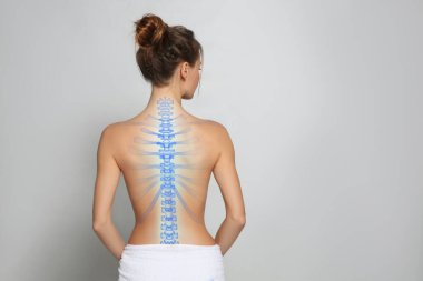 Woman with healthy spine on light background, back view. Space for text clipart