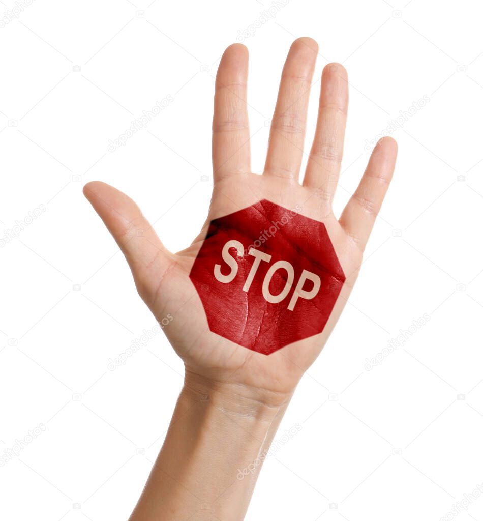 Woman showing palm with drawn STOP sign on white background, closeup