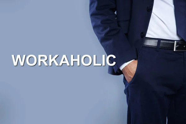 Man Hand Pocket Word Workaholic Light Grey Background Closeup — Foto Stock