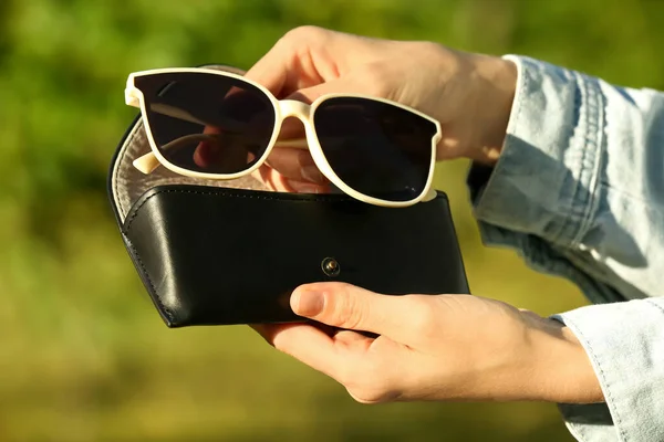 Woman Holding Sunglasses Case Outdoors Sunny Day Closeup — 스톡 사진