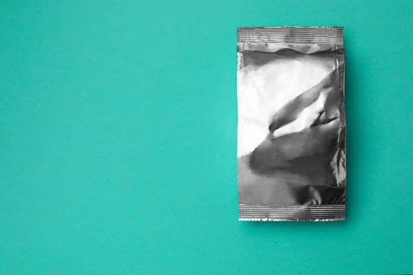 Blank Foil Package Turquoise Background Top View Space Text — Fotografia de Stock