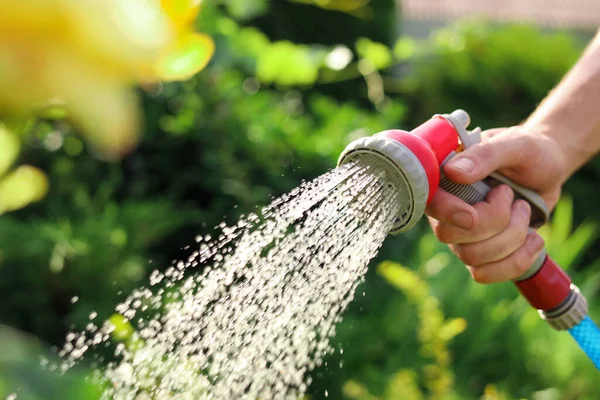 Man Watering Plants Hose Garden Closeup — Stok Foto