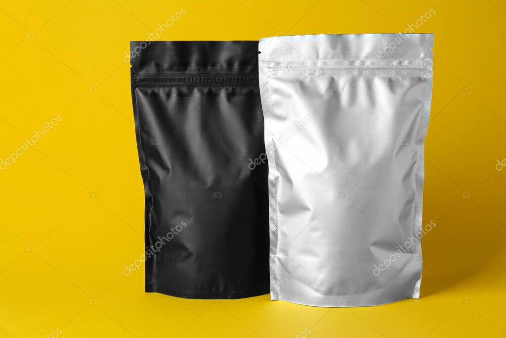 Different blank foil packages on yellow background