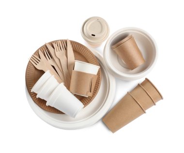 Set of disposable tableware on white background, top view