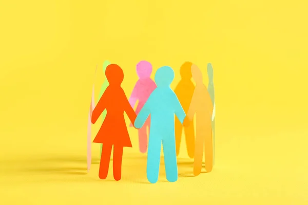 Many Different Paper Human Figures Standing Circle Yellow Background Diversity — Stockfoto