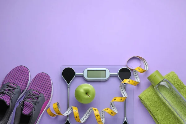 Flat Lay Composition Electronic Scales Measuring Tape Violet Background Space — Stock Photo, Image