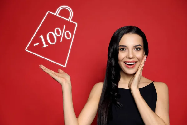 Surprised Woman Pointing Sign Discount Red Background Special Promotion — стоковое фото