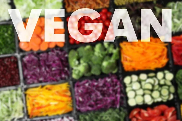 Word Vegan Blurred View Different Fresh Vegetables Top View — Foto de Stock