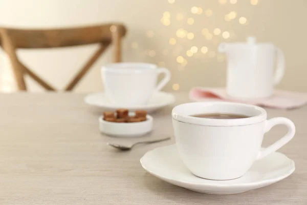 Cup Aromatic Coffee White Wooden Table Indoors Space Text Bokeh — Stockfoto