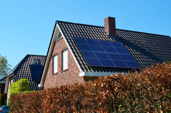 Building with installed solar panels on roof. Alternative energy source