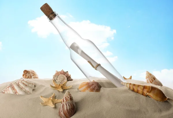 Corked Glass Bottle Rolled Paper Note Seashells Sand Sky — Stock Photo, Image