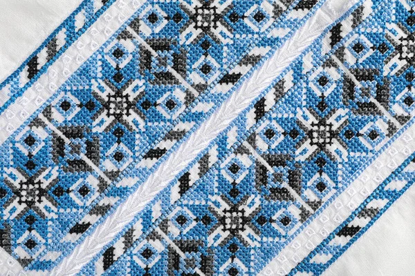 Beautiful Light Blue Ukrainian National Embroidery White Fabric Top View — Φωτογραφία Αρχείου
