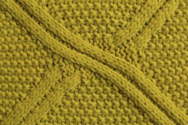 Stylish soft knitted fabric as background, top view