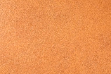 Arka plan olarak turuncu deri dokusu, yakın plan.