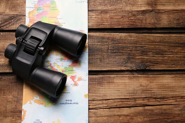 Modern Binoculars Map Wooden Table Top View Space Text — Stock Photo, Image