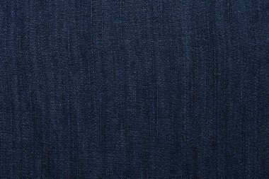 Arka plan olarak koyu mavi kotun dokusu, yakın plan