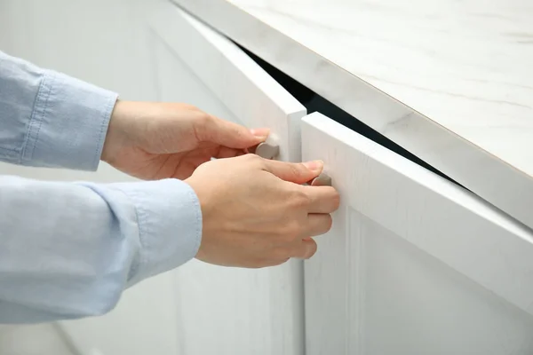 Woman Opening Cabinet Doors Home Closeup — Photo