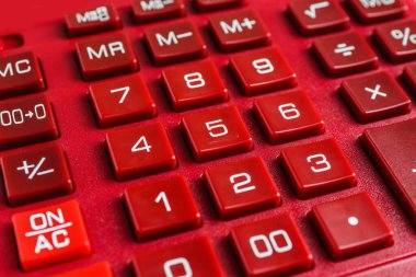 Closeup view of red calculator as background