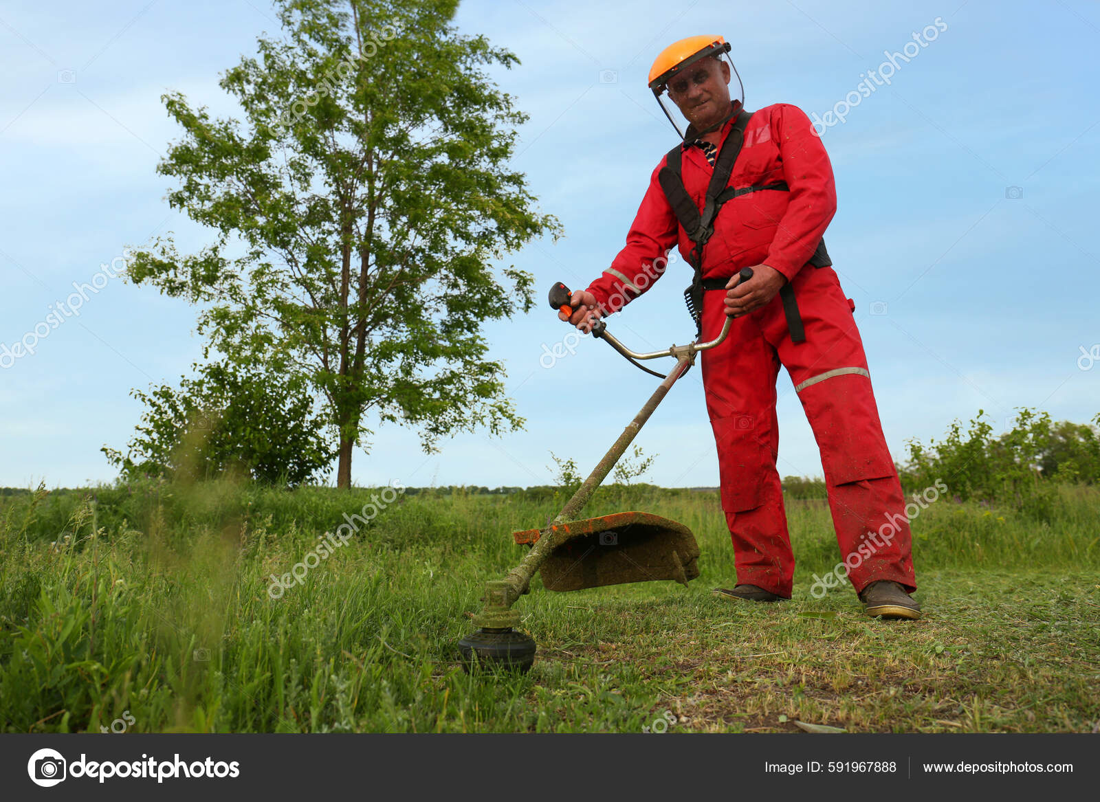 Worker Cutting Grass String Trimmer Outdoors Stock Photo NewAfrica 591967888