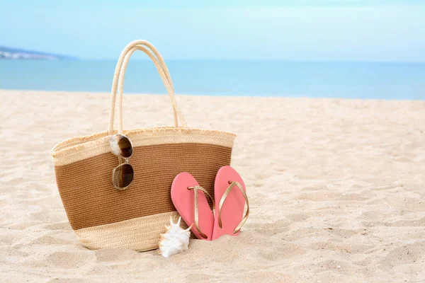 Stylish Straw Bag Sunglasses Flip Flops Shell Sand Sea Space — Photo