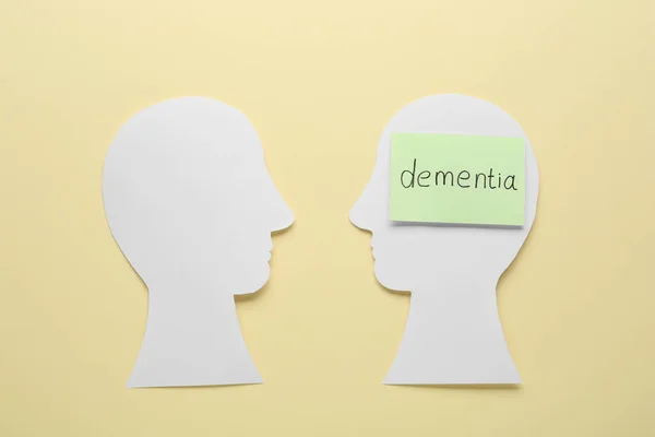 Human Heads Cutout Word Dementia Beige Background Flat Lay — Foto de Stock