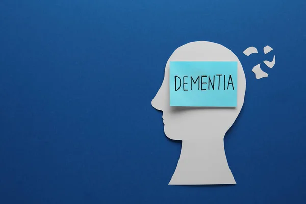 Human Head Cutout Word Dementia Blue Background Flat Lay Space — Stockfoto