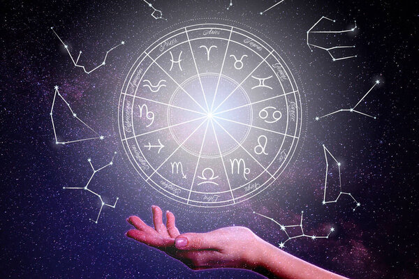 Closeup view of woman and illustration of zodiac wheel with astrological signs against starry sky in night