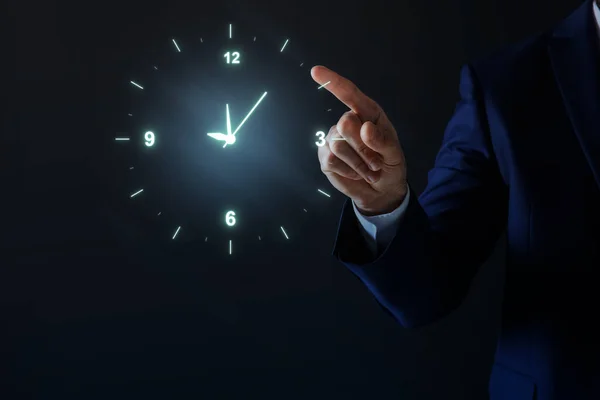Man Holding Virtual Icon Clock Dark Background Closeup Time Management — Φωτογραφία Αρχείου