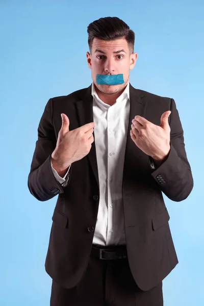 Man Taped Mouth Light Blue Background Speech Censorship — стоковое фото