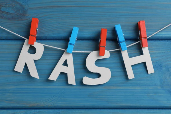 Word Rash Hanging Turquoise Wooden Background — Stockfoto