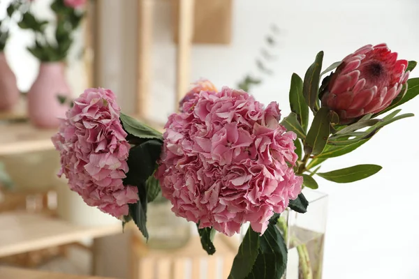 Fresh beautiful flowers in florist's workshop, closeup