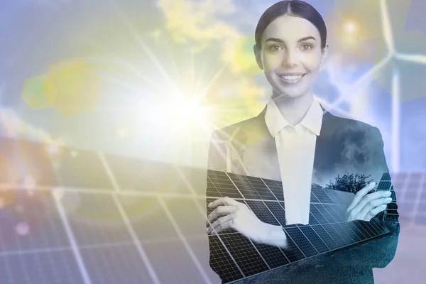 Multiple exposure of businesswoman, wind turbines and solar panels installed outdoors. Alternative energy source