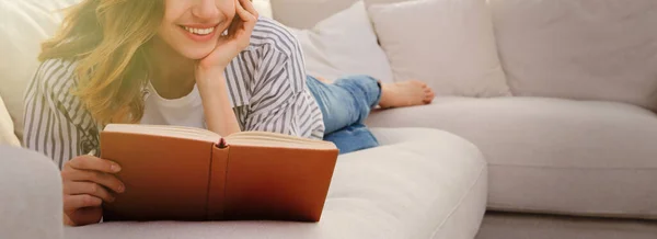 Young Woman Reading Book Sofa Home Space Text Banner Design — Fotografia de Stock