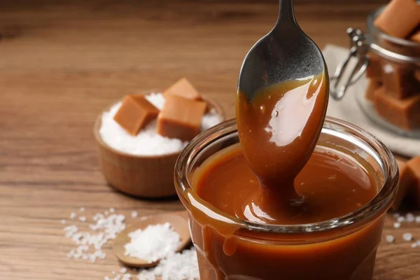 Taking Tasty Salted Caramel Spoon Glass Closeup Space Text — Foto de Stock