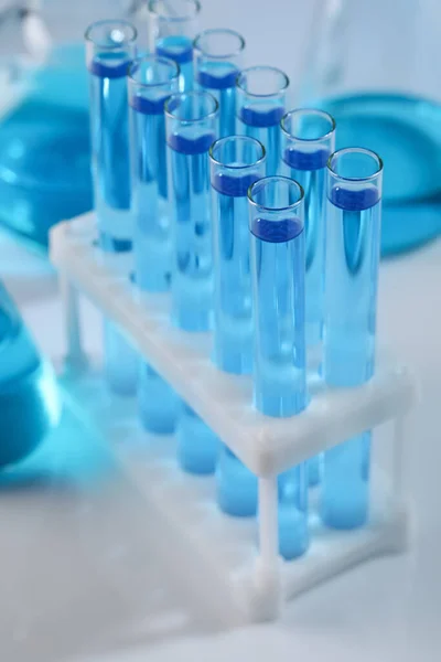 Test Tubes Blue Liquid Light Background Closeup — ストック写真