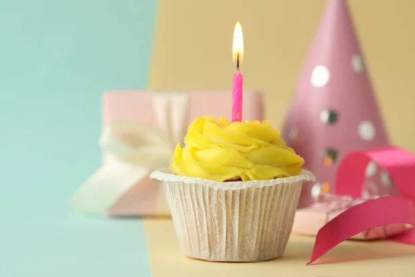 Tasty Birthday Cupcake Candle Gift Box Party Hat Colorful Background —  Fotos de Stock