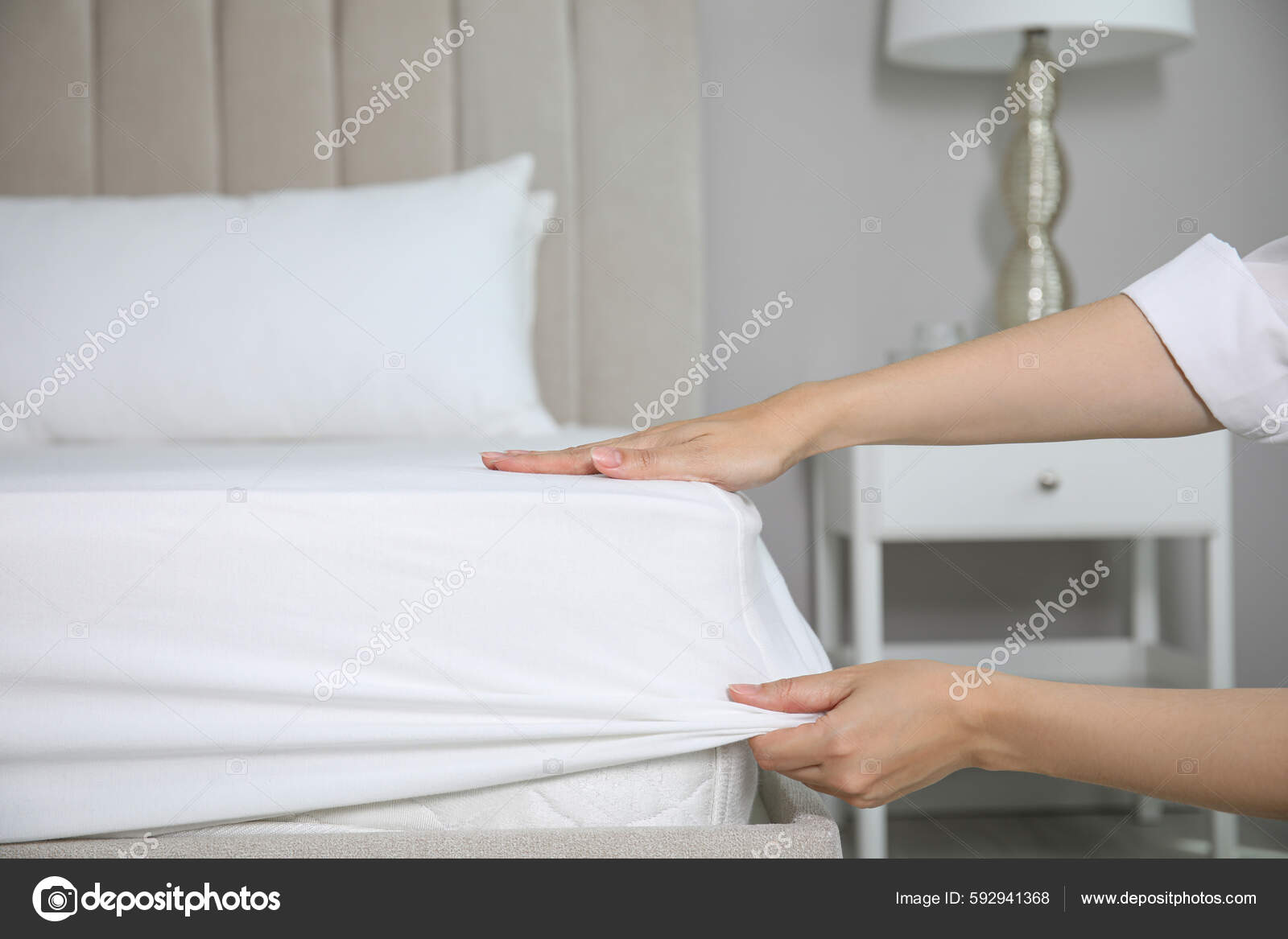 Woman Putting White Fitted Sheet Mattress Bed Indoors Closeup Stock unruly-and-difficult-to-manage-the-fitted-sheet-often-refuses-to-fit