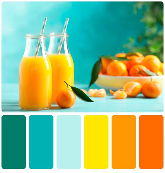Color matching palette. Bottles of fresh tangerine juice on blue wooden background
