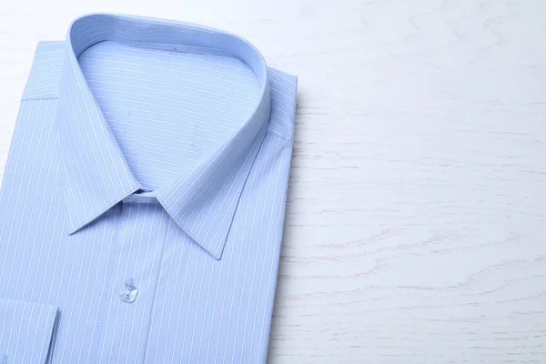 Stylish Light Blue Shirt White Wooden Table Top View Space — Foto de Stock