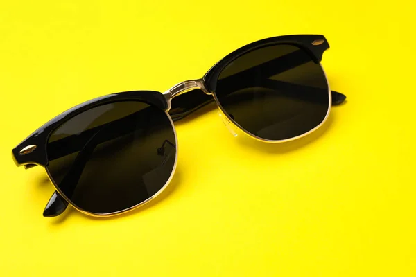 New Stylish Elegant Sunglasses Yellow Background — Zdjęcie stockowe