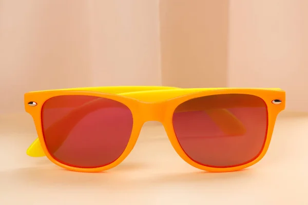 New Stylish Elegant Sunglasses Beige Background Closeup — Stok fotoğraf