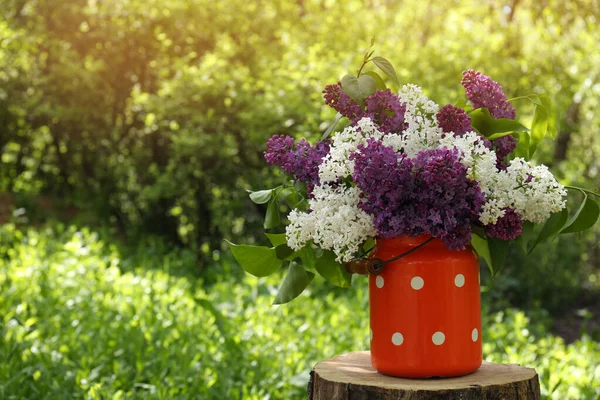 Bouquet Beautiful Lilac Flowers Milk Can Outdoors Space Text — стоковое фото