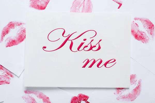 Card Phrase Kiss Lipstick Marks White Background Top View — стоковое фото