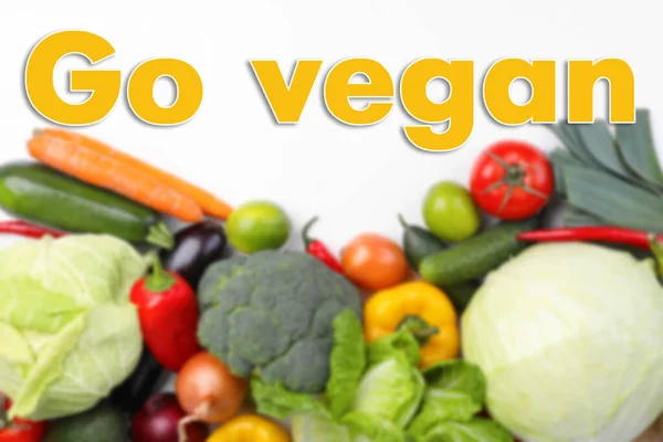 Phrase Vegan Blurred View Fresh Vegetables White Background Flat Lay — Foto de Stock
