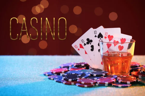 Word Casino Chips Playing Cards Glass Alcohol Table Red Background — Foto de Stock