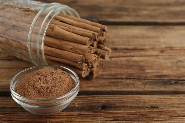 Aromatic Cinnamon Powder Sticks Wooden Table Closeup Space Text — Stock Photo, Image