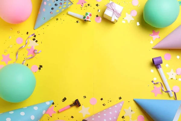 Frame Made Party Hats Birthday Decor Yellow Background Flat Lay — Φωτογραφία Αρχείου