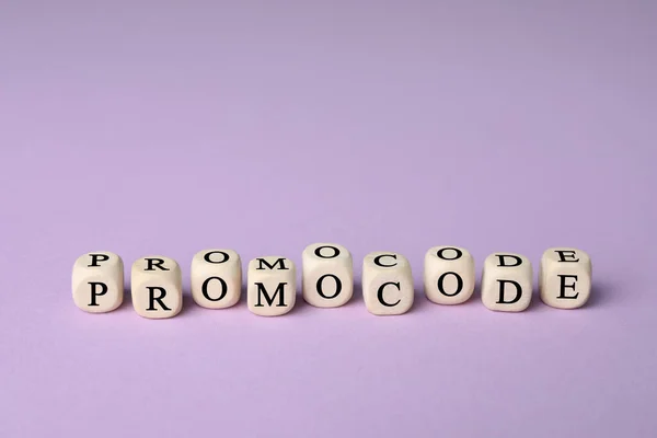 Wooden Cubes Words Promo Code Violet Background — Stockfoto