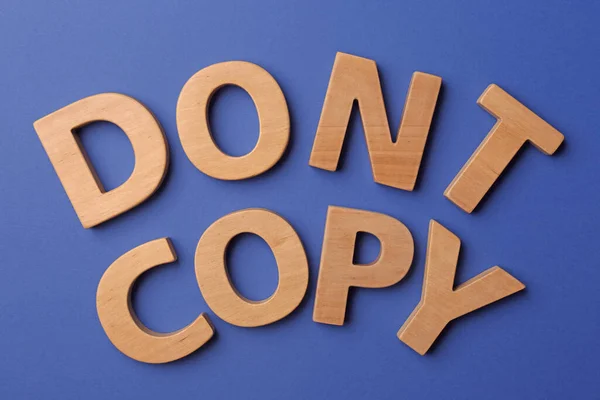 Plagiarism Concept Phrase Don Copy Made Wooden Letters Blue Background — 图库照片