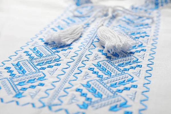 Beautiful Light Blue Ukrainian National Embroidery White Fabric Closeup — Stockfoto